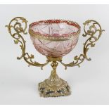 A coloured glass mounted centrepiece. The pink cut glass bowl having a lobed rim with plain and