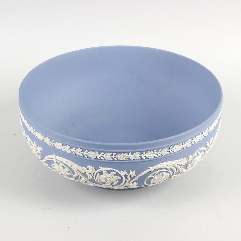A Wedgwood blue jasperware fruit bowl. Of squat circular form, decoration with a frieze of oak
