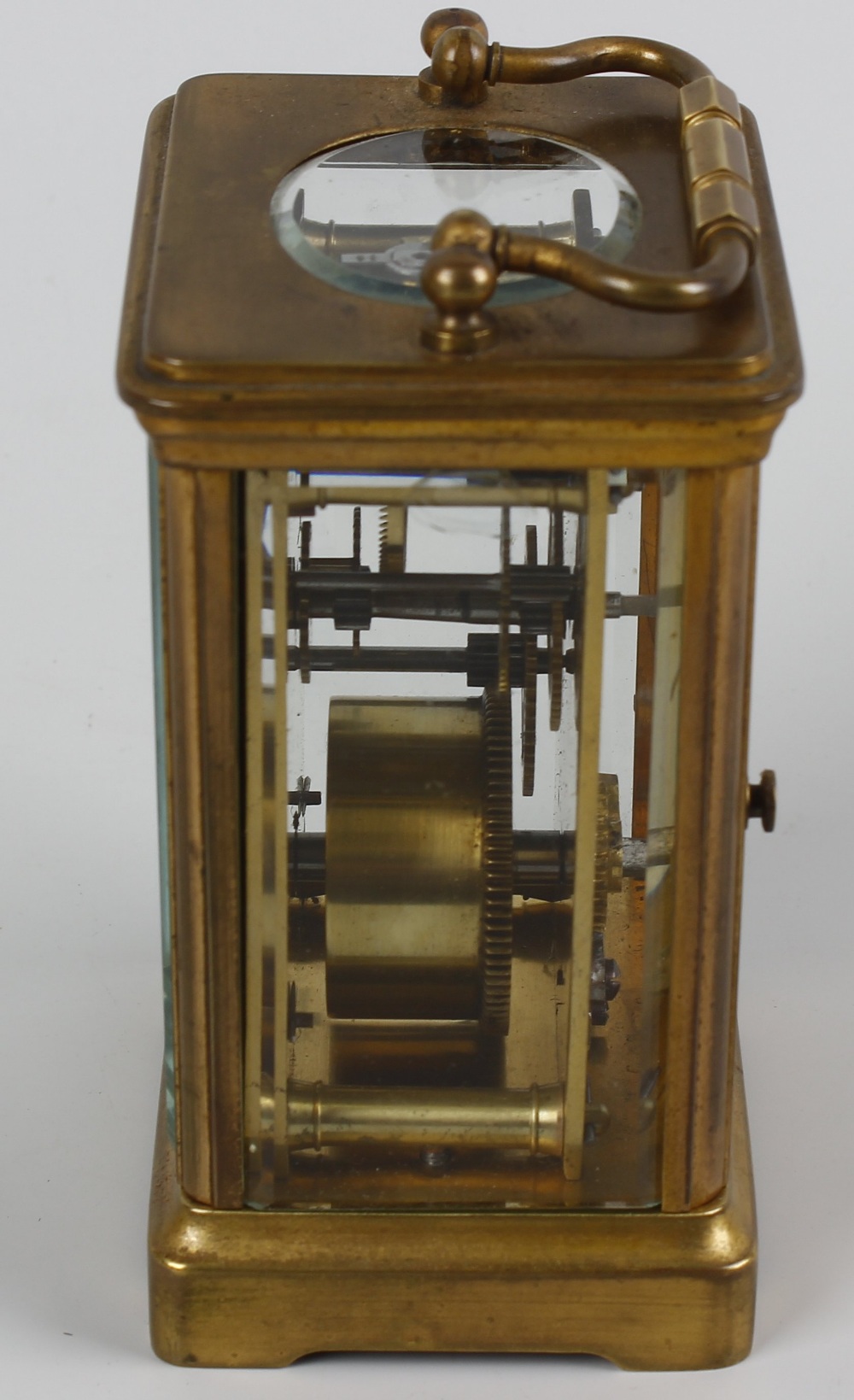 A late 19th century brass cased carriage clock. The 2 inch white dial with black Roman numerals - Image 2 of 5