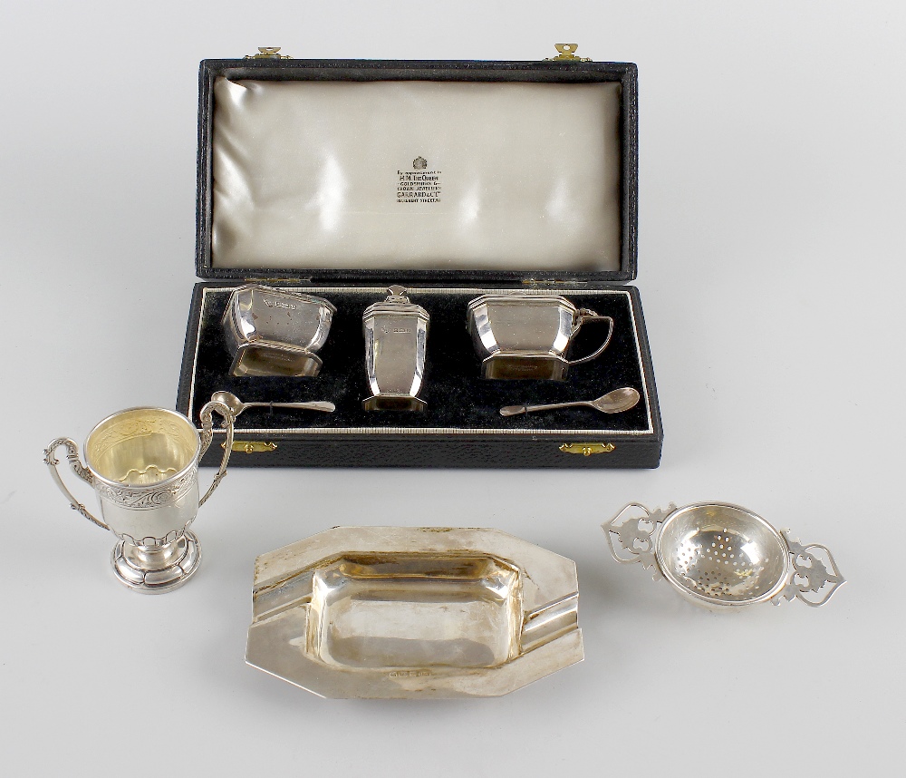 A small selection of silver items to include a 1930's silver ashtray, of elongated octagonal form,