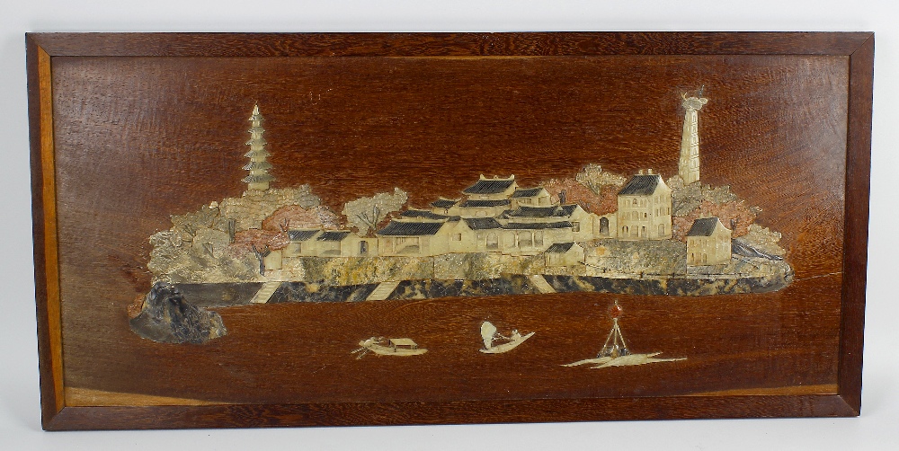 A 19th century Chinese carved soapstone and wooden panel. Depicting landscape scene in low relief