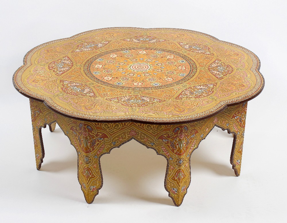 A 20th century Russian polychrome-decorated low table. The eight-lobed top with central rosette,