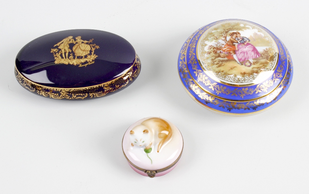 A box containing an assortment of modern porcelain and papier mache boxes. Together with a large