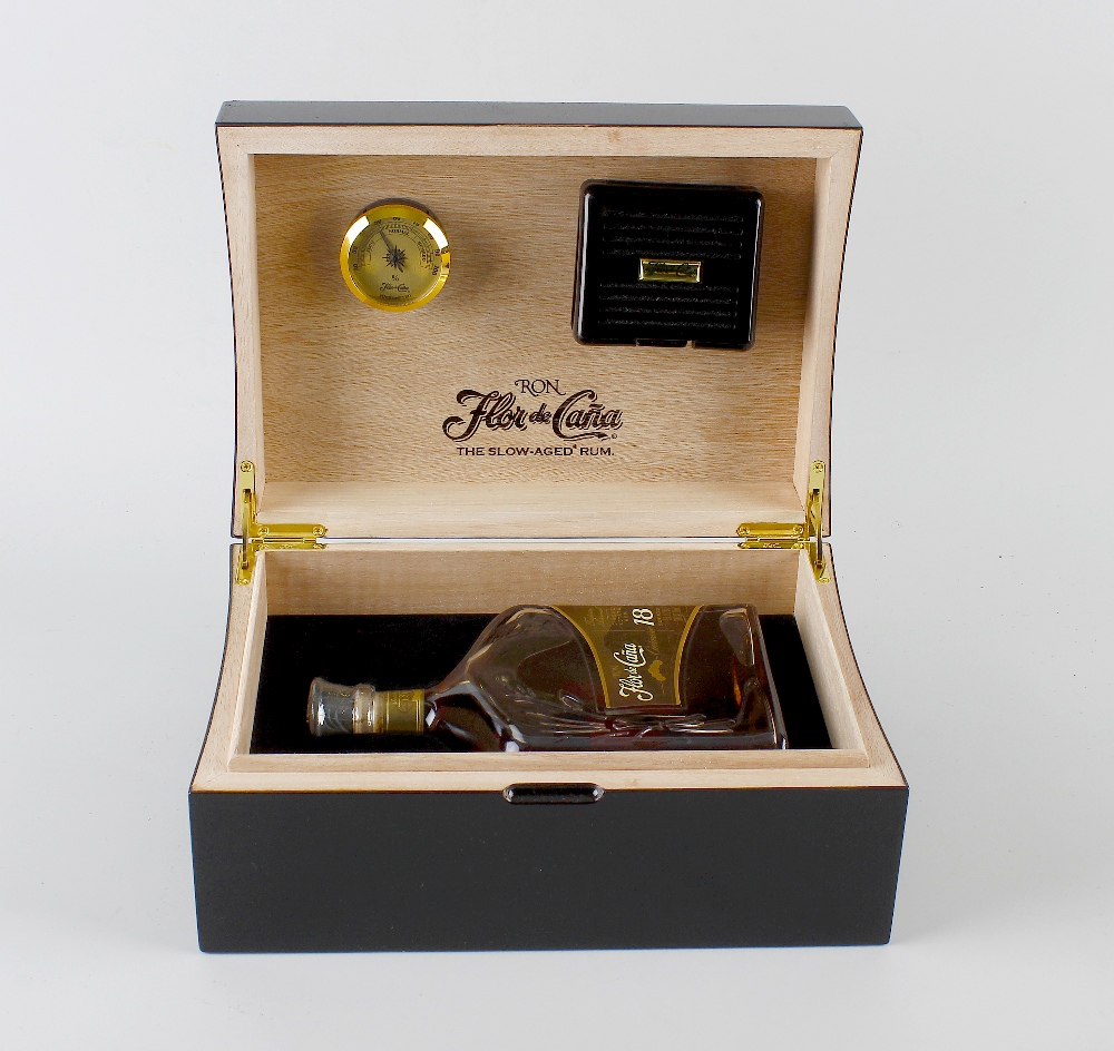 A boxed 750ml bottle of Ron Flor de cana single estate rum. 18 years old, 35% ABV, in branded