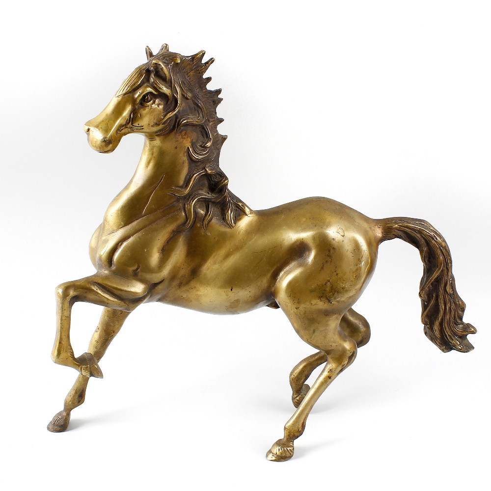A modern bronze figure of a horse. Modelled in stylised rearing stance with flowing mane and tail,