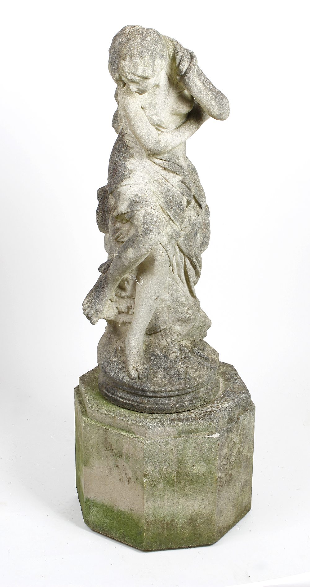 A composition garden statue. Modelled as a classical-style odalisque or maiden, 33, (84cm) high,