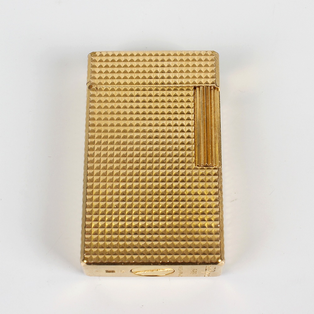 Dupont - a gold-plated cigarette lighter, 7628EA, of textured rectangular form, 2.25, (5.5cm)