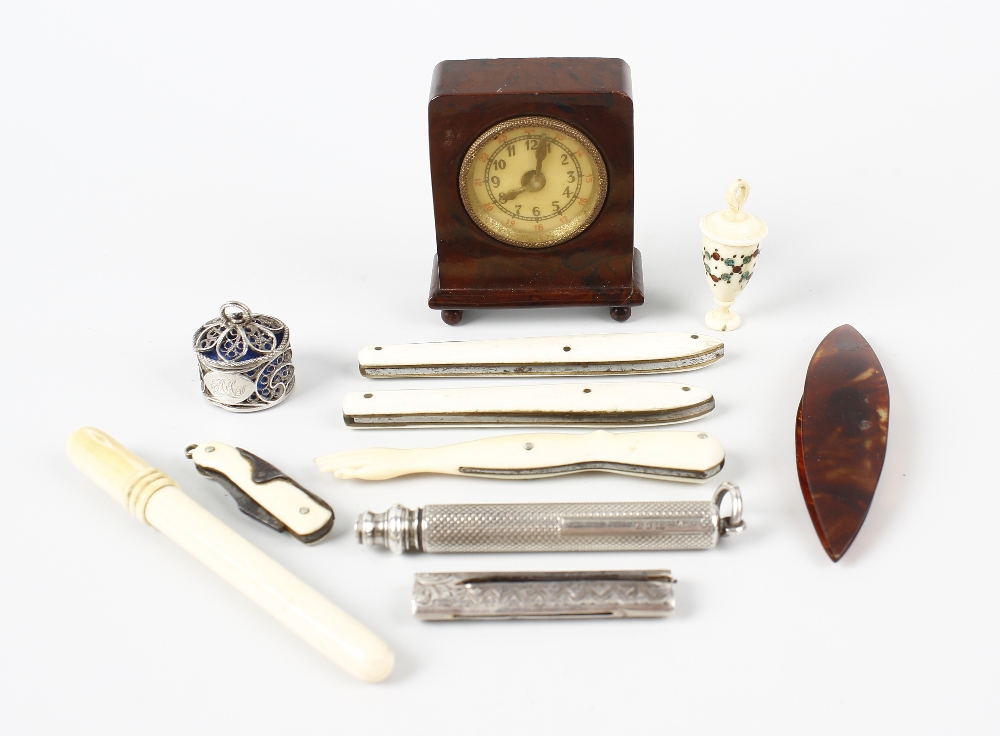 A selection of items, to include an unusual early 20th century tape measure with brown Bakelite