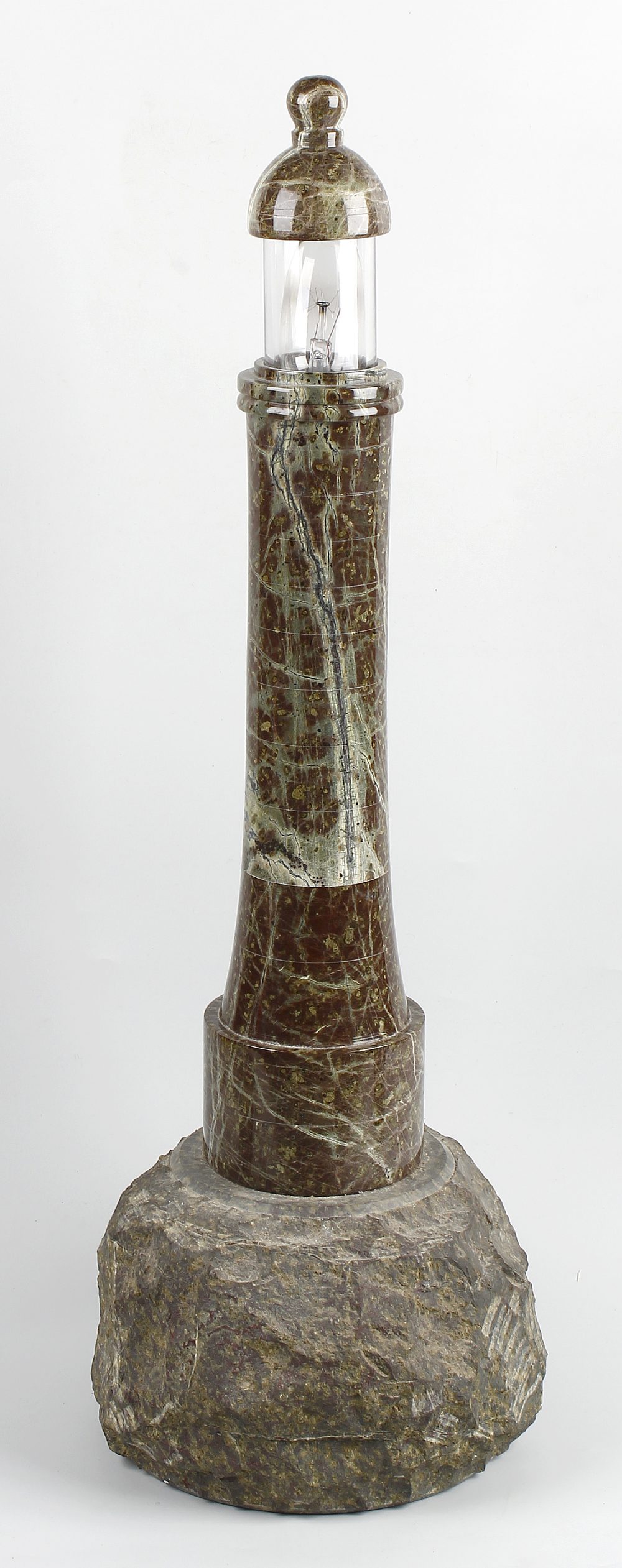 A large Cornish green serpentine lamp base Modelled as a lighthouse with domed cover over glazing,
