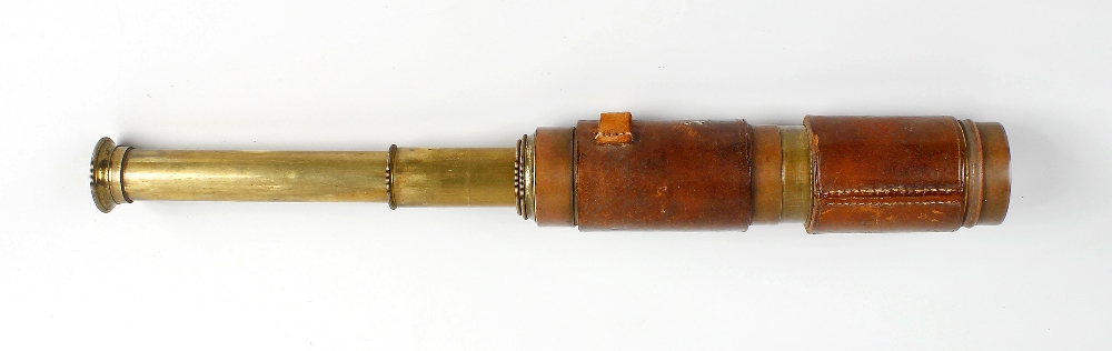 A 19th century hide-bound three-draw telescope With 1.75-inch lens, the unmarked draw tubes within