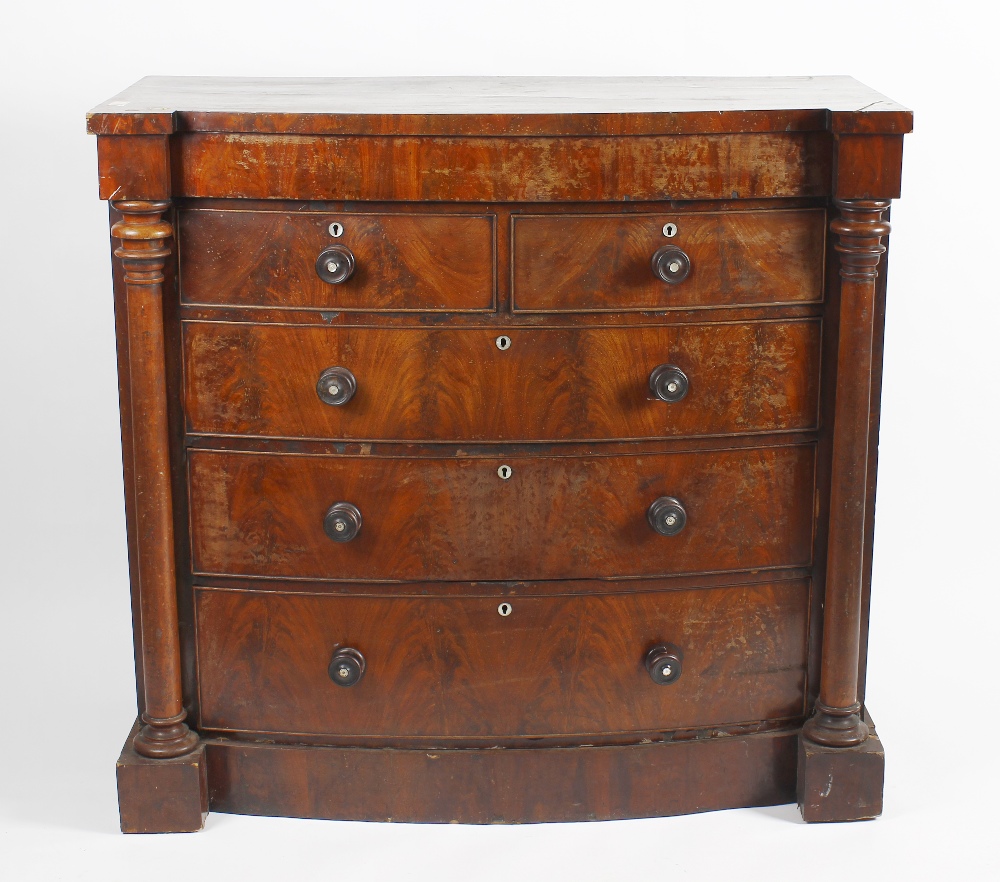 A late 19th century mahogany chest of drawers, the bowed inverted break front fitted with a