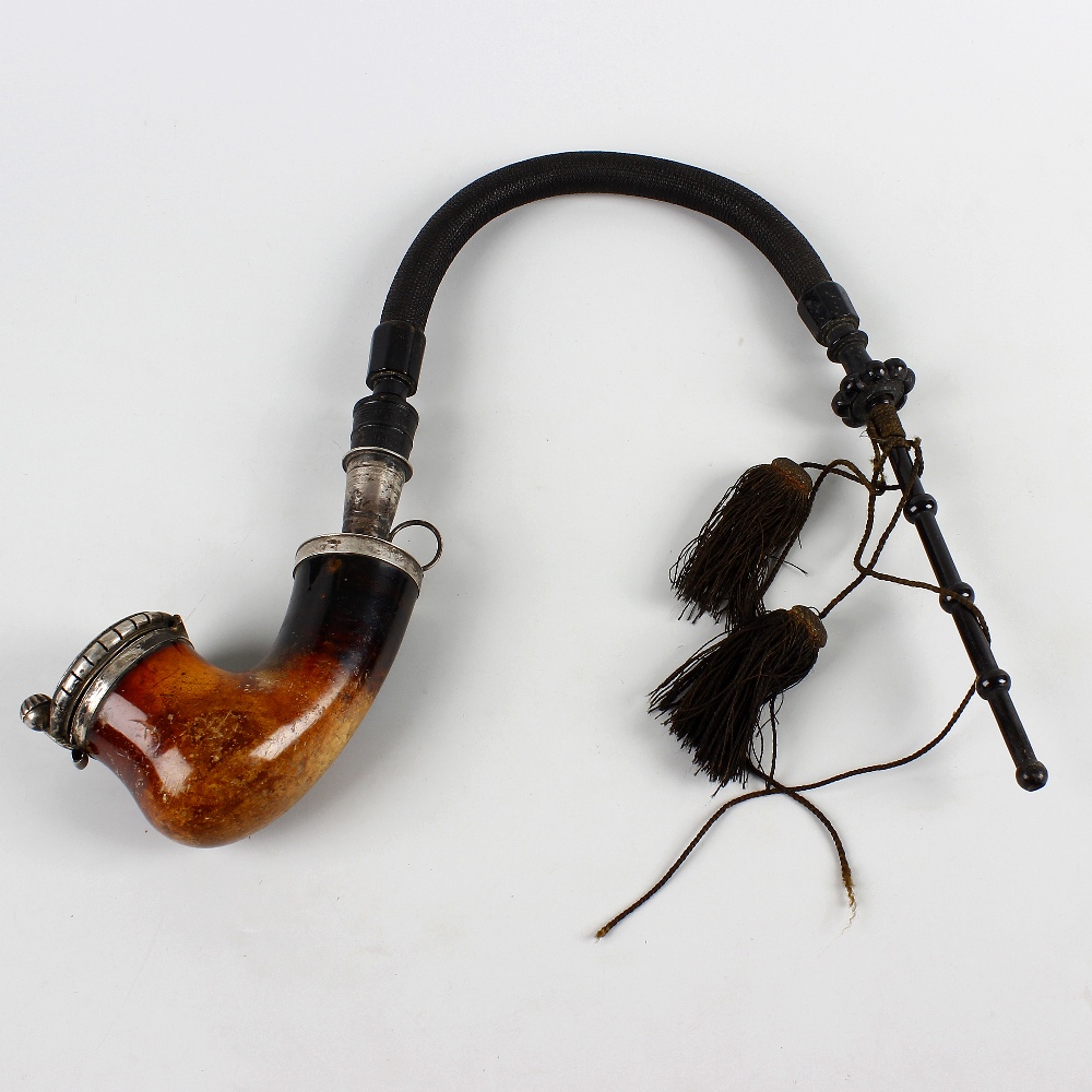 A 19th century white metal-mounted meerschaum pipe. Of calabash type, the hinged metal cover with