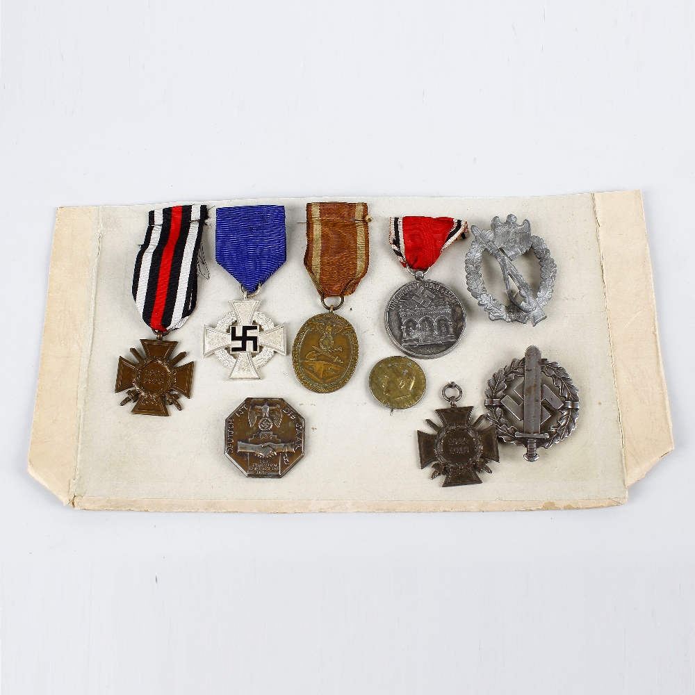 A group of assorted German badges and medals. To include World War I and Third Reich examples, (