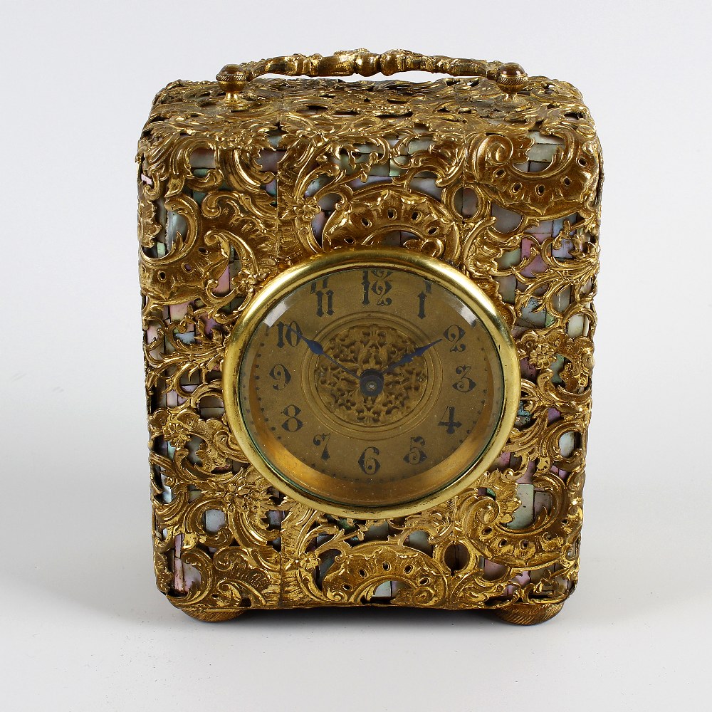 An unusual late 19th century French mother of pearl and gilt metal travel clock. With 2.25-inch