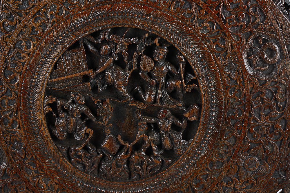 A 19th century Chinese carved wooden octagonal table top. The centre modelled in deep relief with - Image 2 of 2