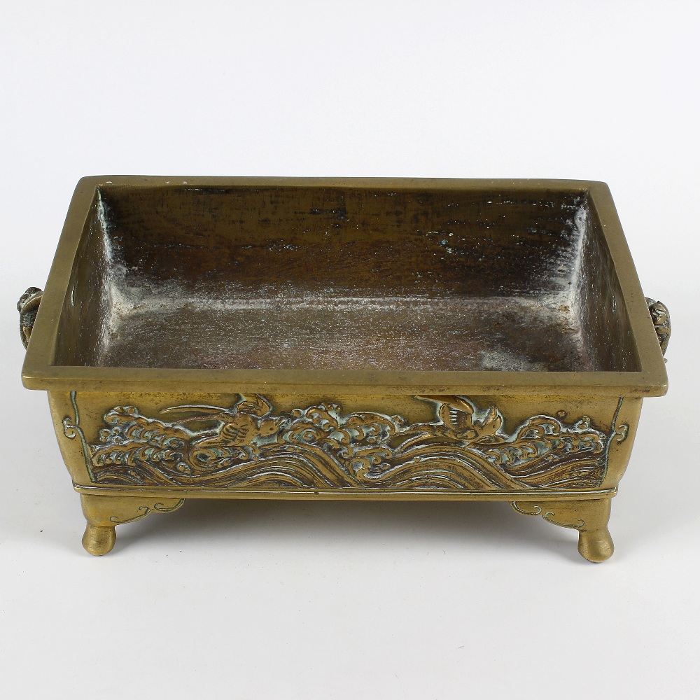 A Japanese bronze bonsai planter. Of rectangular two-handled trough form cast with fish (perhaps