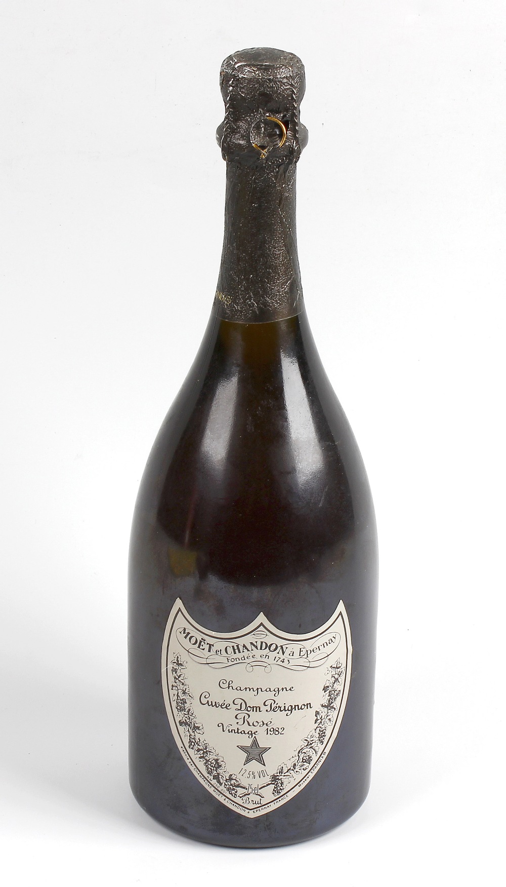 A bottle of Cuvee Dom Perignon Rose Champagne vintage 1982, 12.5% ABV, label and neck in good