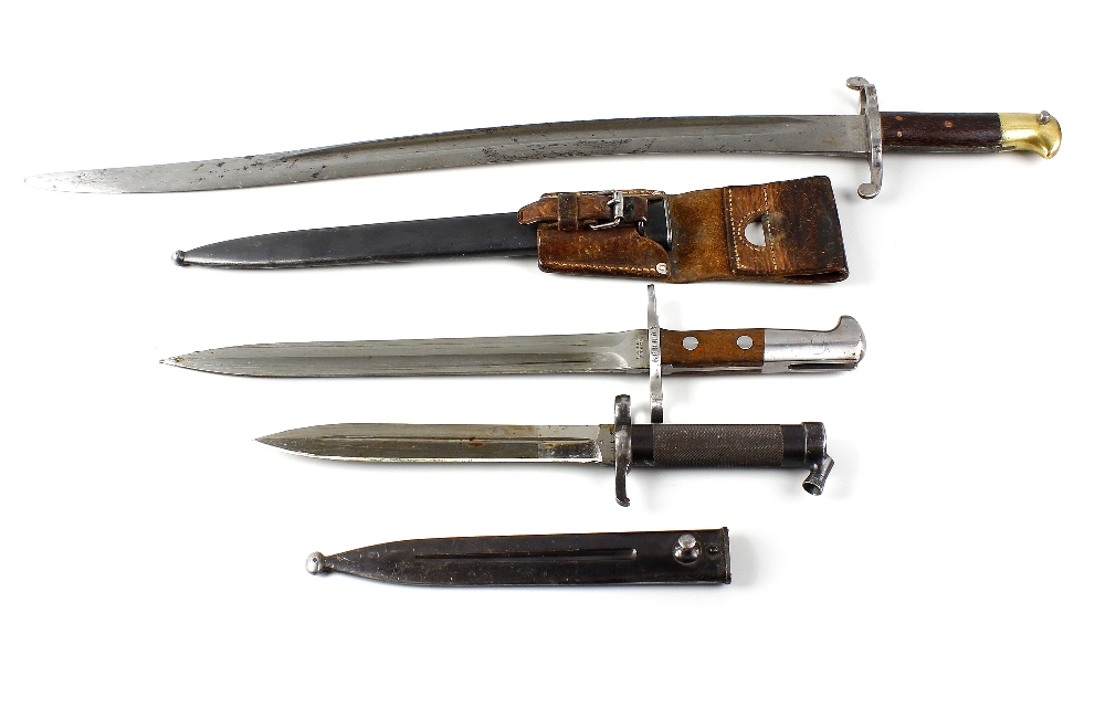 An early 20th century Swiss bayonet with wooden handle, steel scabbard and attached leather frog,