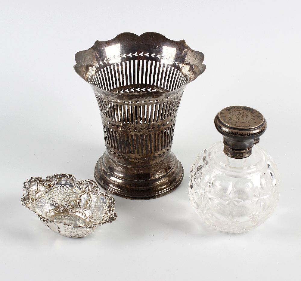 A small group of silver items. Comprising a pair of silver lidded toiletry jars with initialled