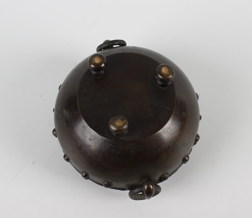 An Oriental bronze koro or incense burner and cover. Of spherical form with pierced domed foliate - Image 3 of 3