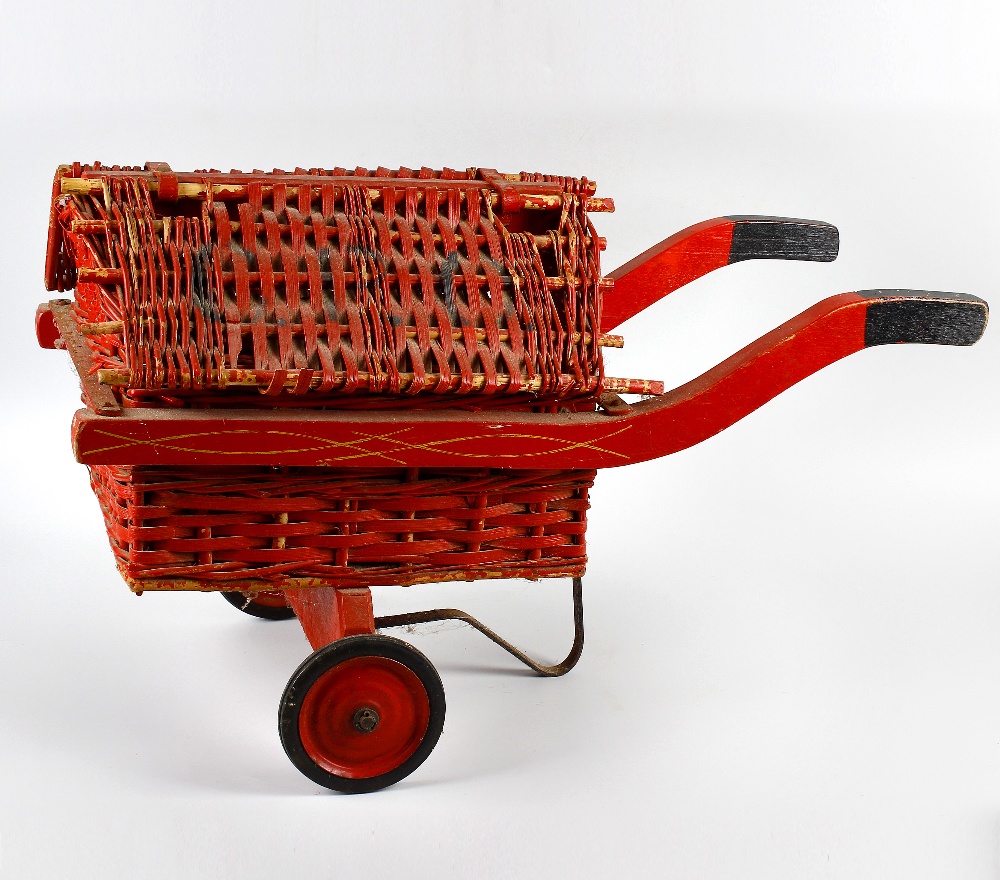 A 1930s GPO type toy cart. With red painted hinged cane and wicker roof, over conforming body and