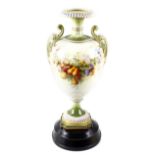 A large Royal Worcester porcelain twin handled vase, the ovoid shaped body upon a moulded plinth