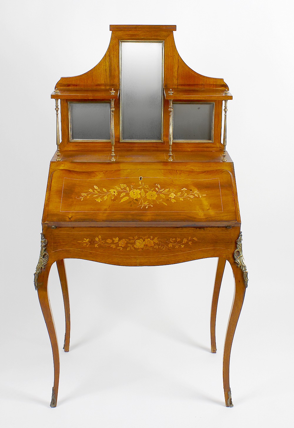 An inlaid rosewood bureau de dame. Circa 1900, the shaped superstructure with central long mirror