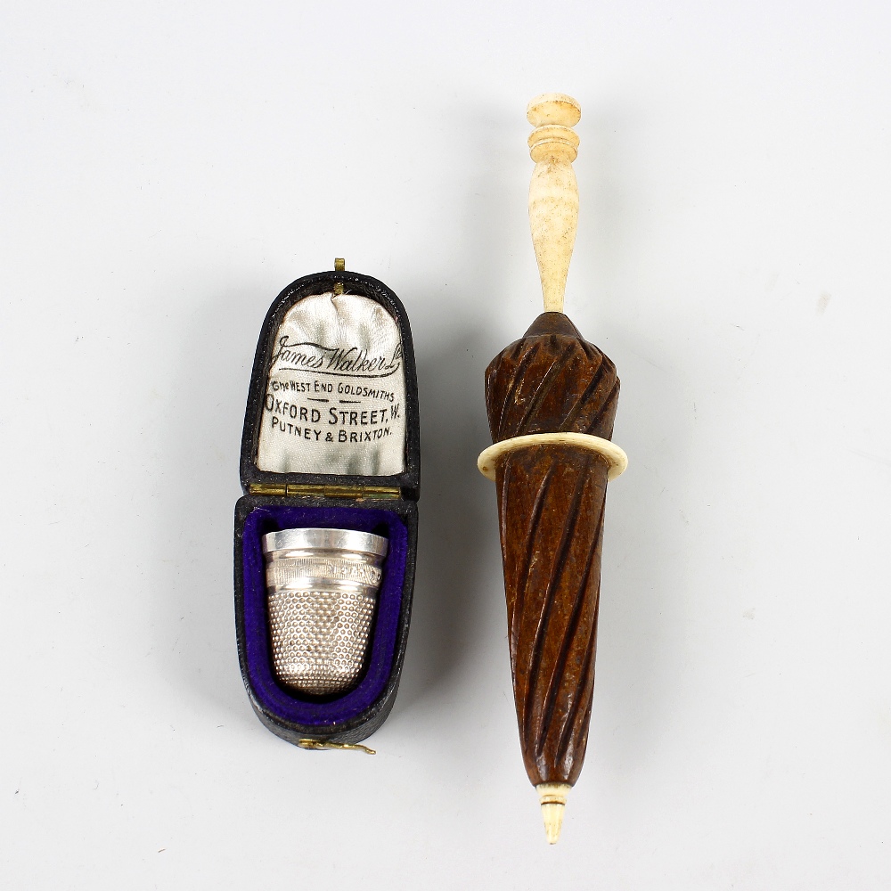 Two sewing-related items. Comprising a silver thimble, 'JAMES WALKER WISHES YOU LUCK', Birmingham,