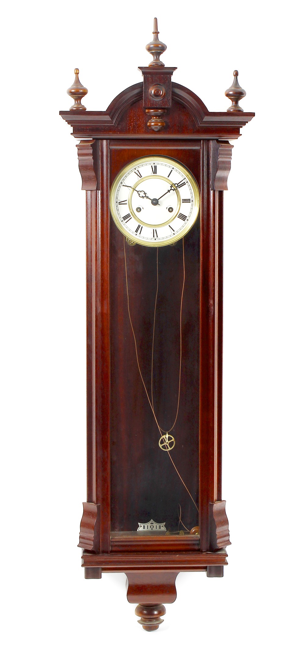 A reproduction Vienna style wall clock. The mahogany veneered case with arched pediment above a