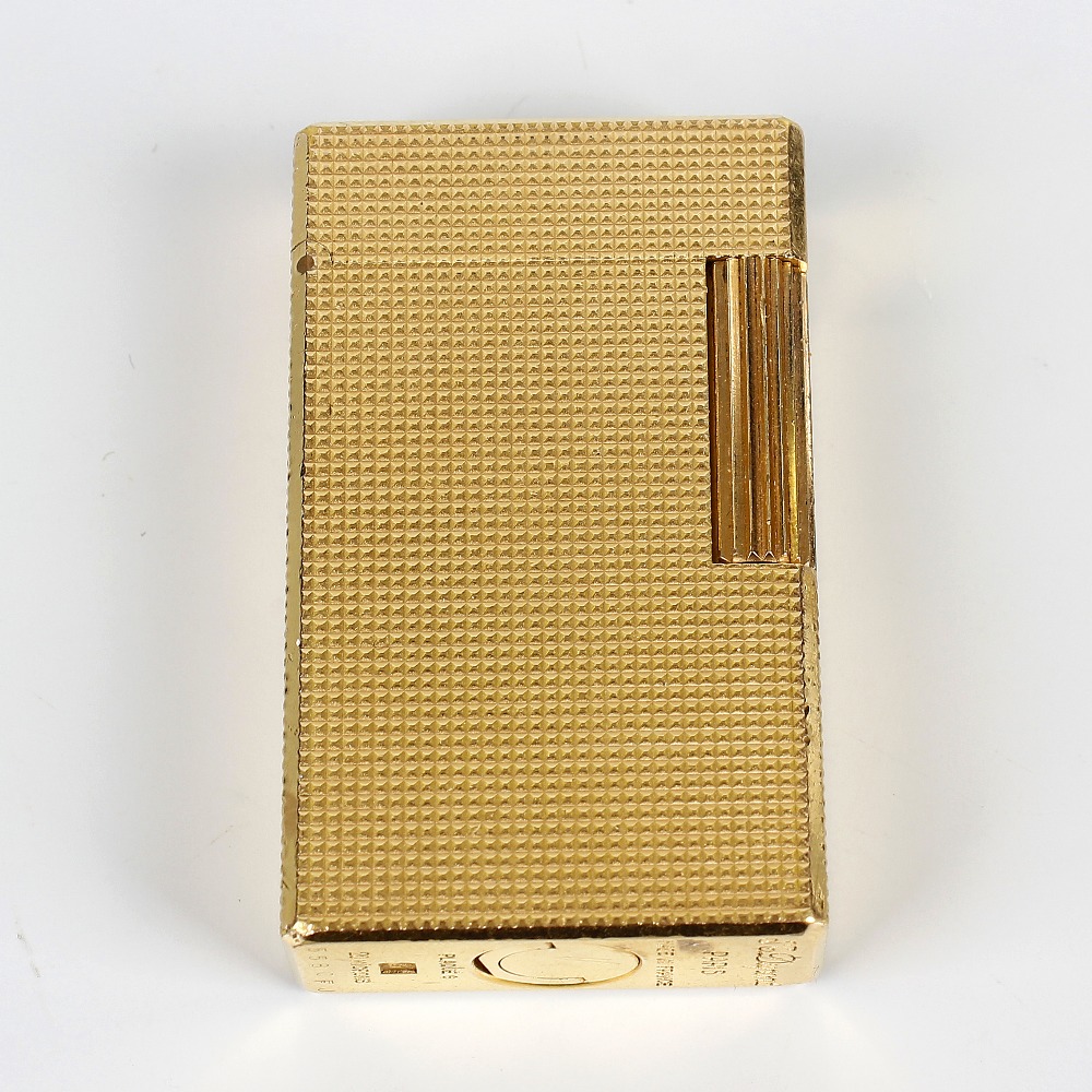 A Dupont gold-plated cigarette lighter. 558CFJ, of textured rectangular form, 2.25, (5.5cm) high.