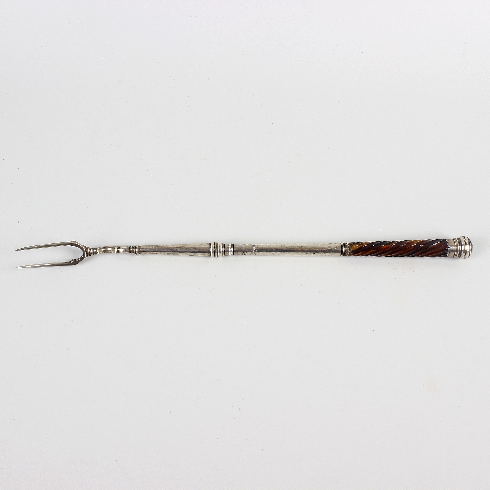 An unusual tortoiseshell-handled white metal toasting fork. Believed 18th century, the two-prong