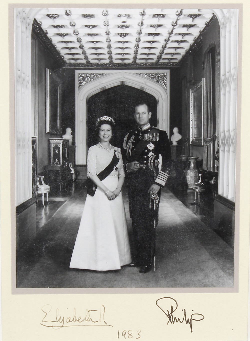 A black and white photographic print of Queen Elizabeth and Prince Phillip Ink signatures beneath