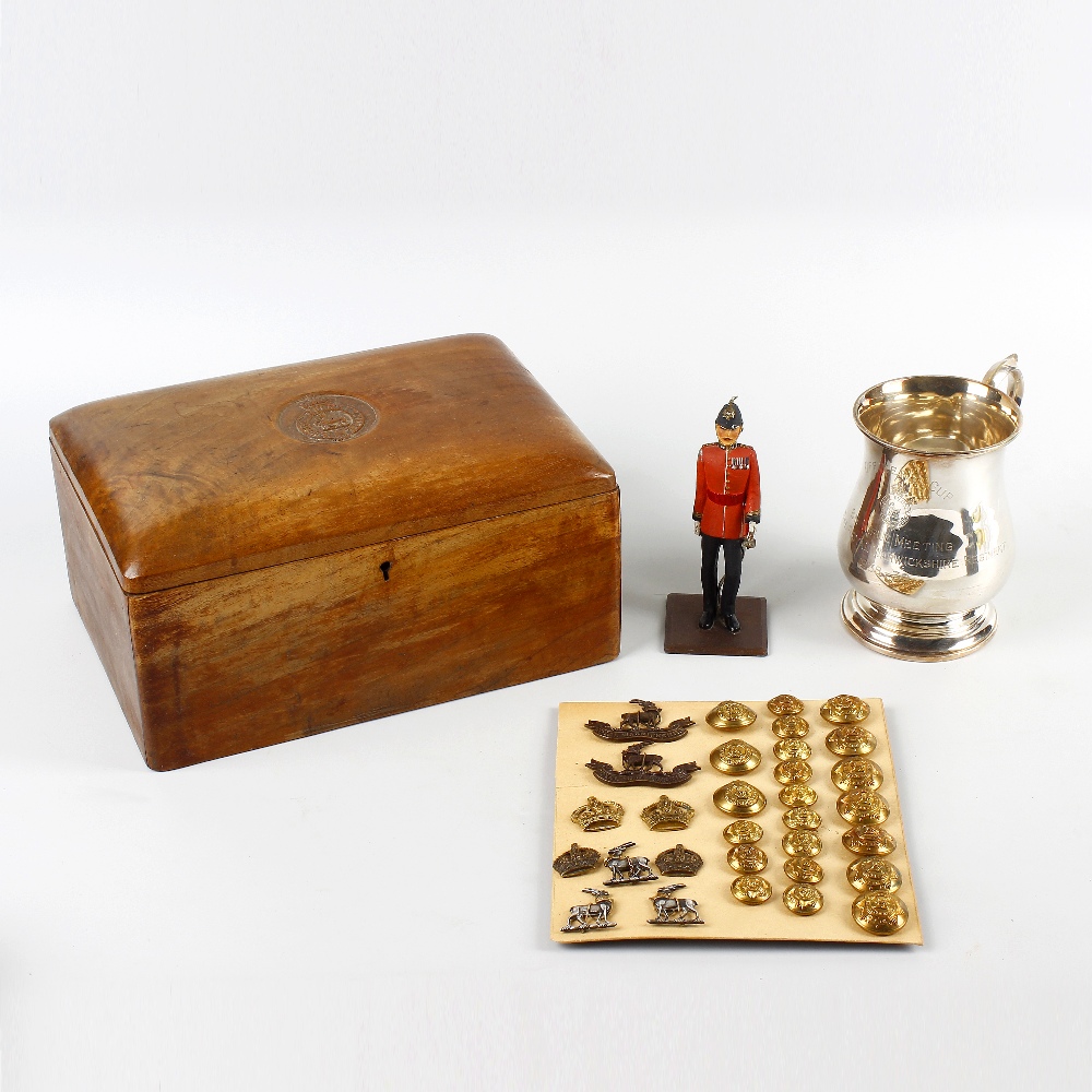 A collection of Warwickshire Regiment memorabilia. Comprising: a walnut humidor or cigar box, the