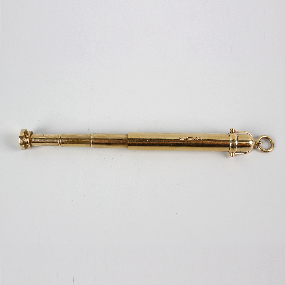 A 9ct gold retractable pencil, of telescopic form with ribbed barrel and further plain cylindrical