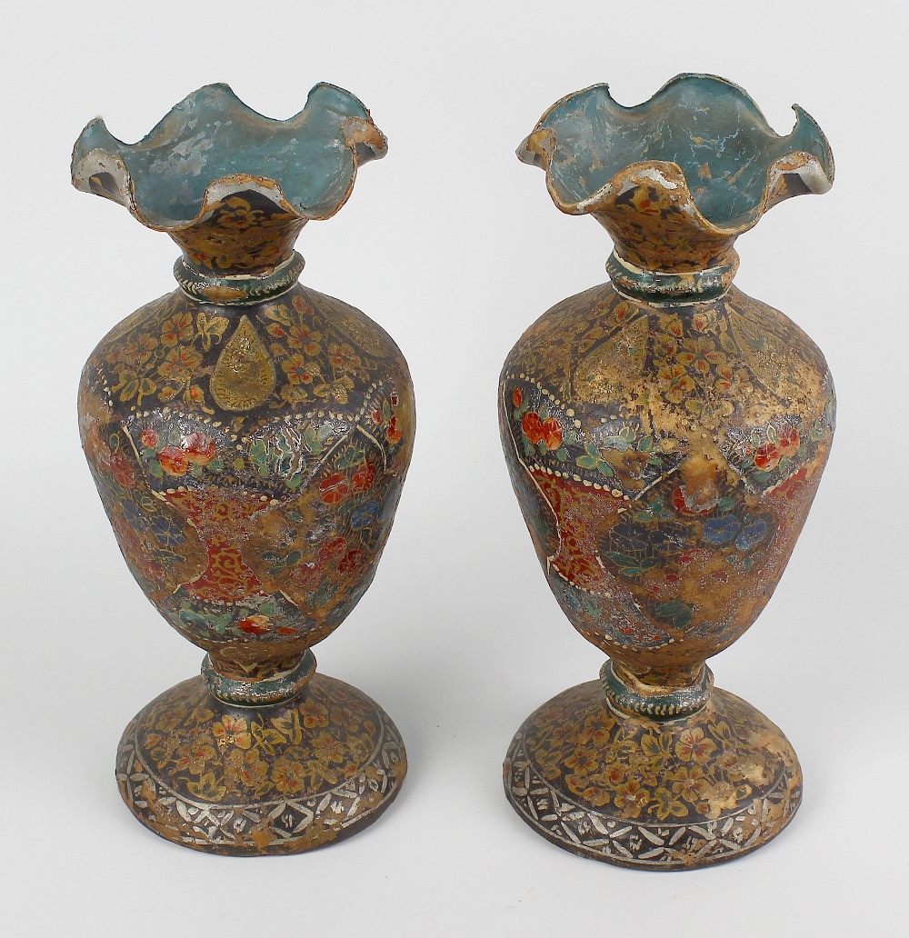 A pair of Persian papier mache vases. Each of ovoid form having exaggerated frilled rim, decorated