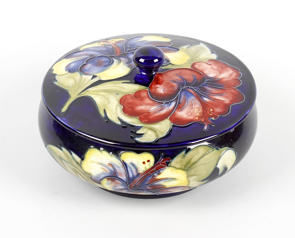 A Moorcroft Hibiscus pattern bowl and cover. Circa 1950s, the circular cover and squat cauldron-form