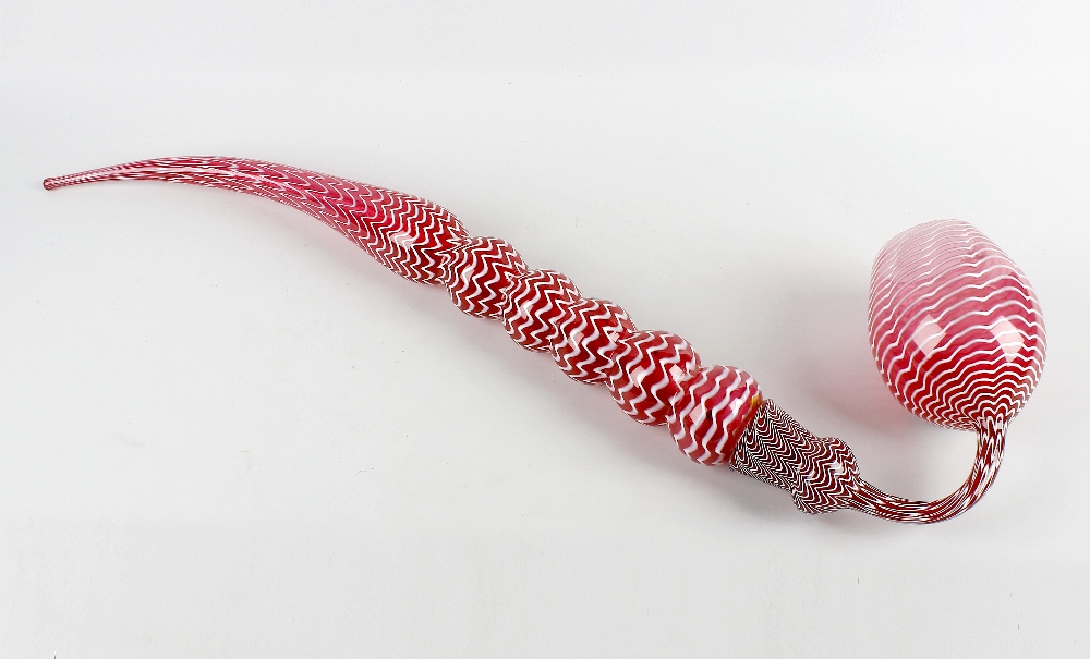 A good Victorian 'Nailsea' cranberry glass frigger pipe, of two-piece construction, the curved