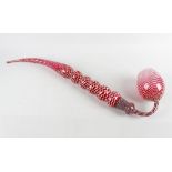 A good Victorian 'Nailsea' cranberry glass frigger pipe, of two-piece construction, the curved