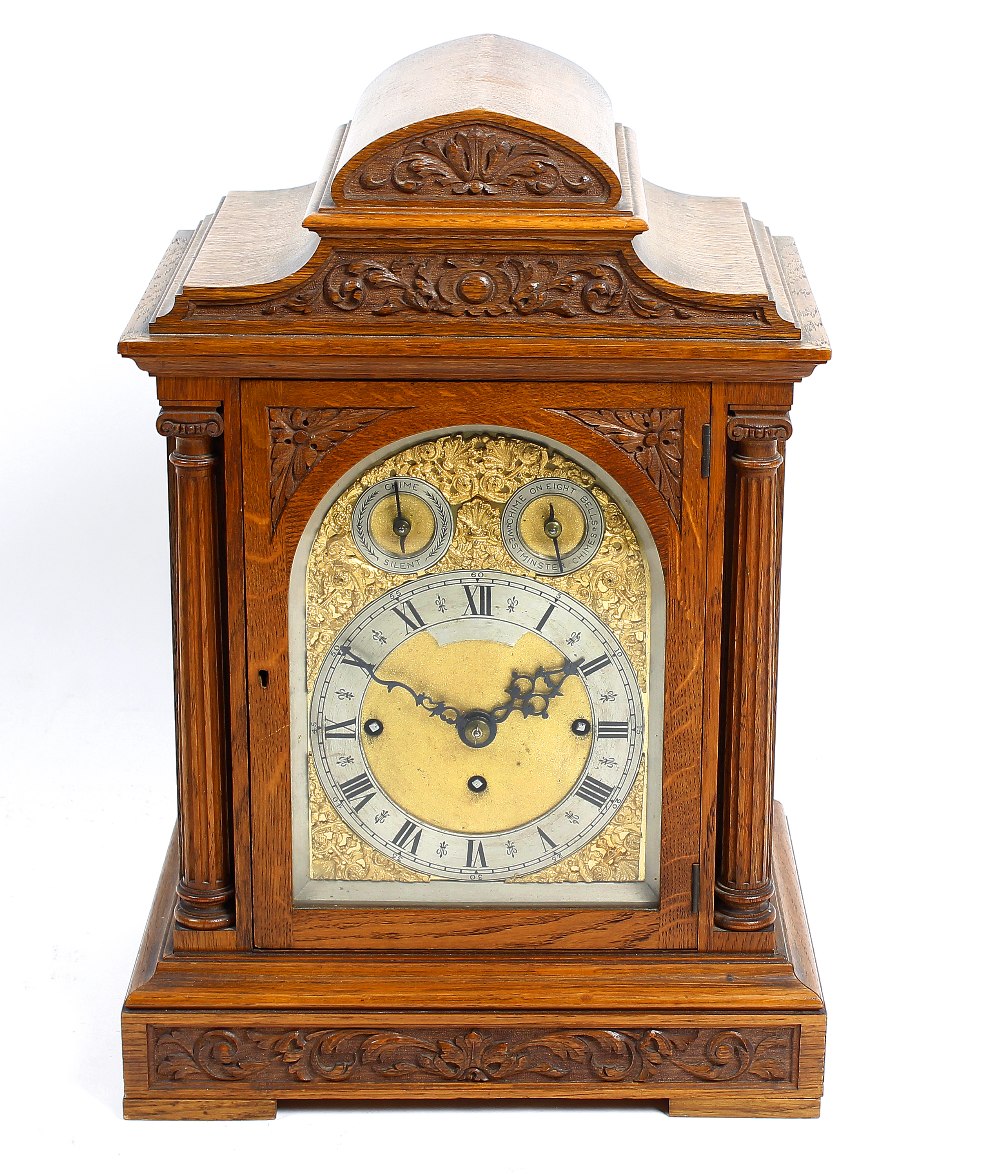 A good late 19th century oak-cased triple fusee bracket or table clock The 6.5-inch arched brass