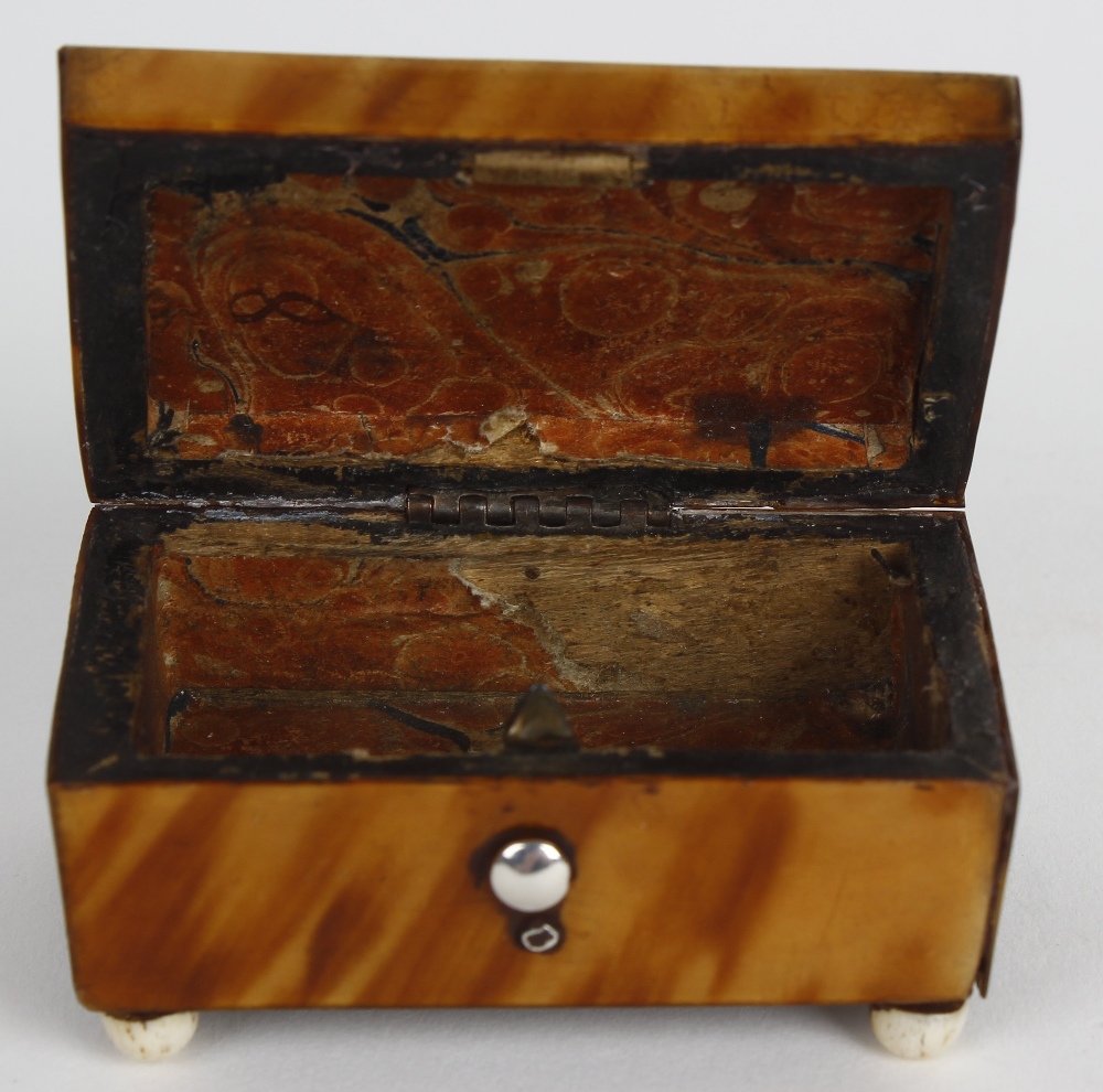 A small 19th century tortoiseshell trinket box. Modelled as a casket with hinged cover opening to - Image 2 of 3