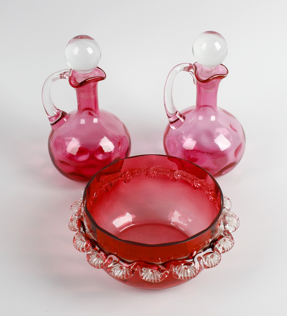 A set of eight glasses, each having cranberry glass bowls with clear glass stems and spreading