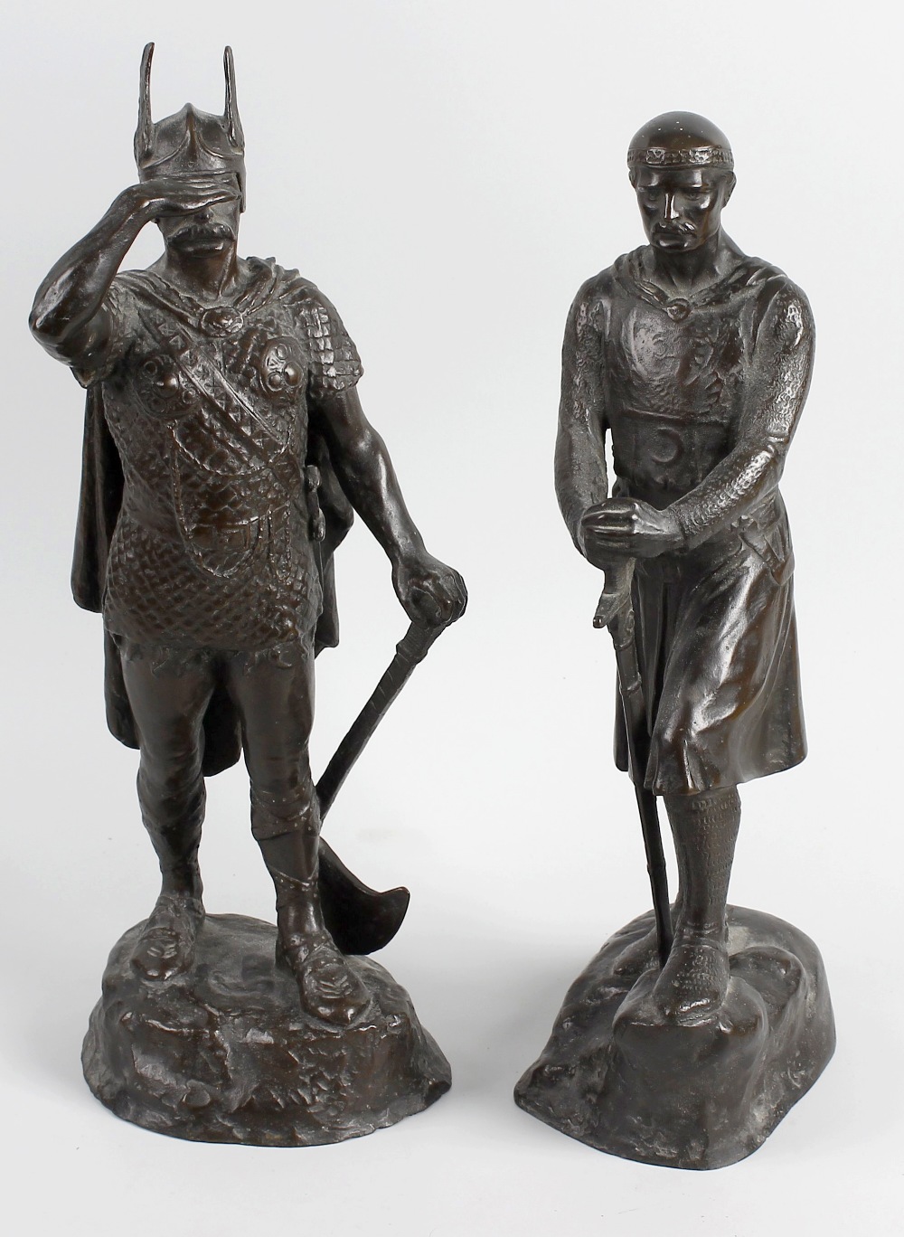 Two bronze figures. Modelled as a Viking and Crusader stood upon naturalistic base having cast