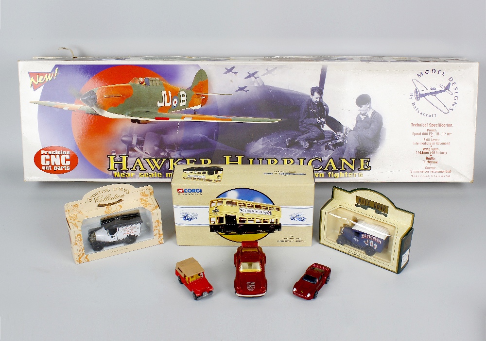 A box containing assorted toys and models. To include Balsacraft Hawker Hurricane, mechanical