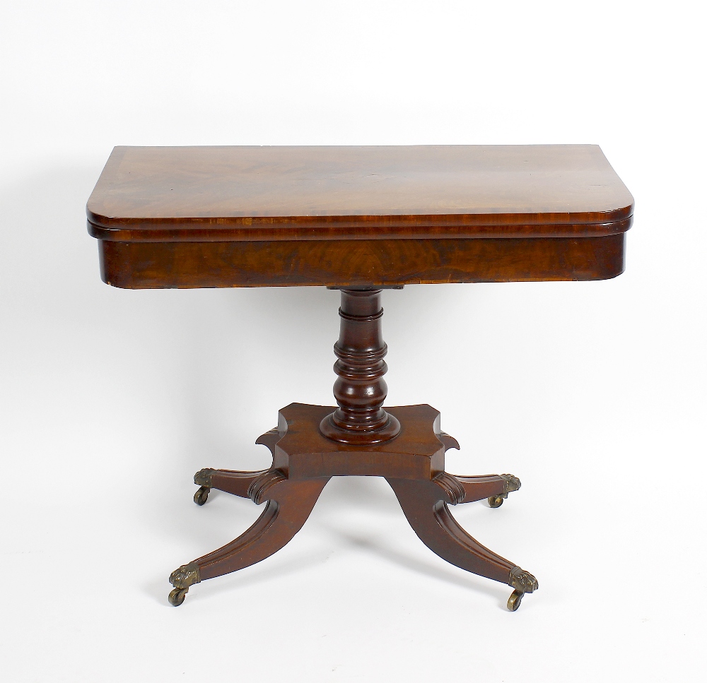 A 19th century mahogany fold over topped card table. The inlaid and cross banded rectangular top