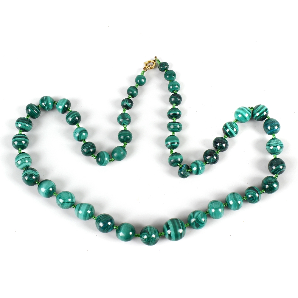A malachite bead necklace. Formed of 47 graduated spherical beads, 24.5, (62cm) long. VGC