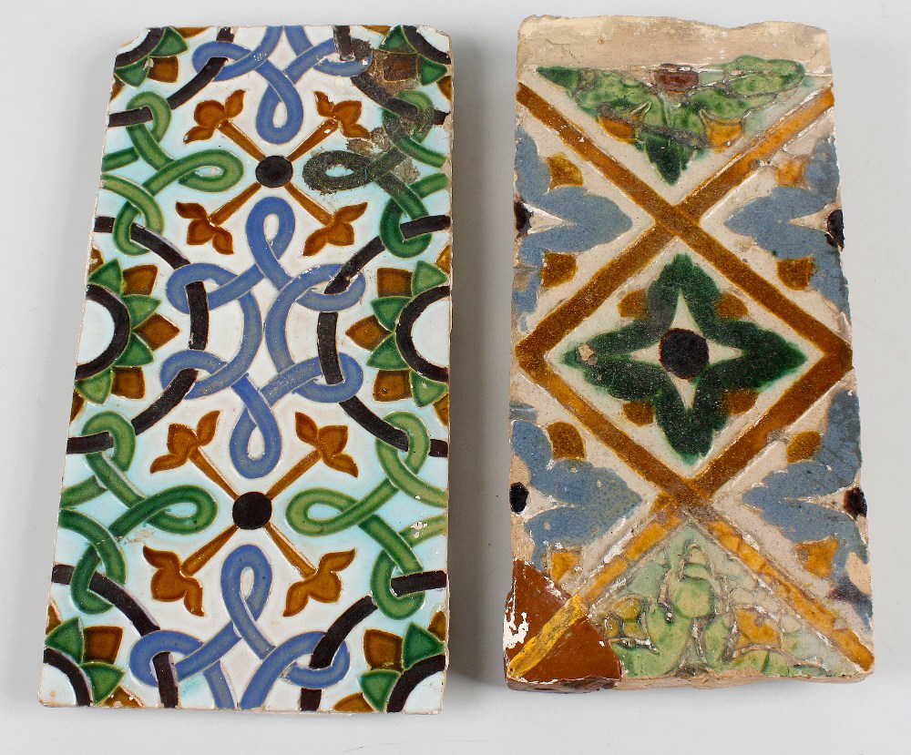 Two terracotta tiles, possibly 17th century, the first with stylised interlocking pattern with