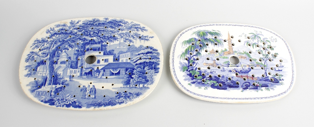 A group of seven 19th century pottery drainers. To include an 'Eastern Street Scene' pattern by