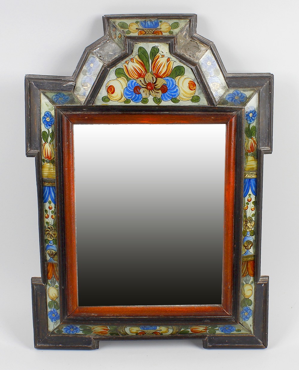 An antique Dutch wall mirror. The rectangular plate within wooden ogee-arched frame having inlaid