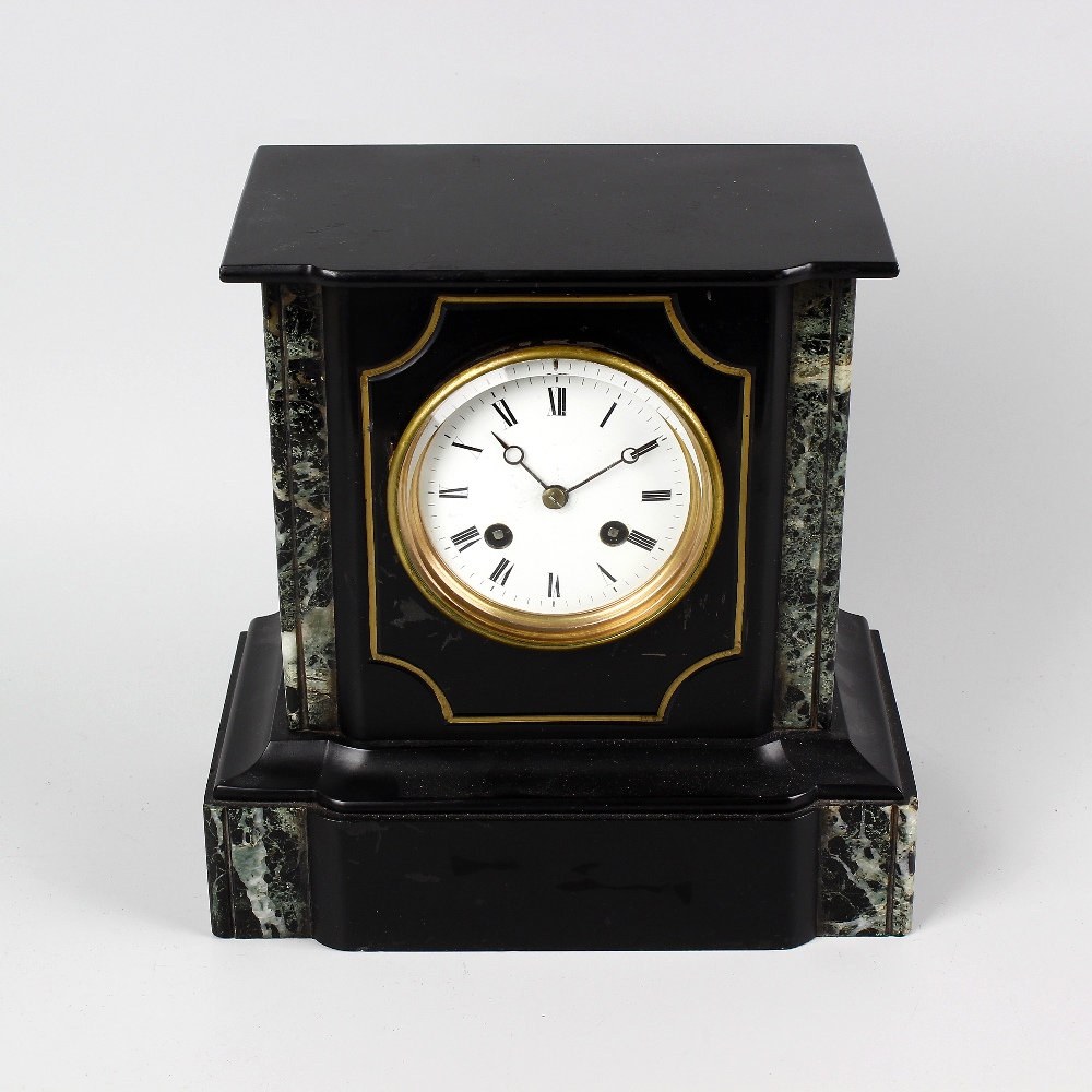 A late 19th century French black slate mantel clock. The 3.5 white Roman dial with Breguet dials,
