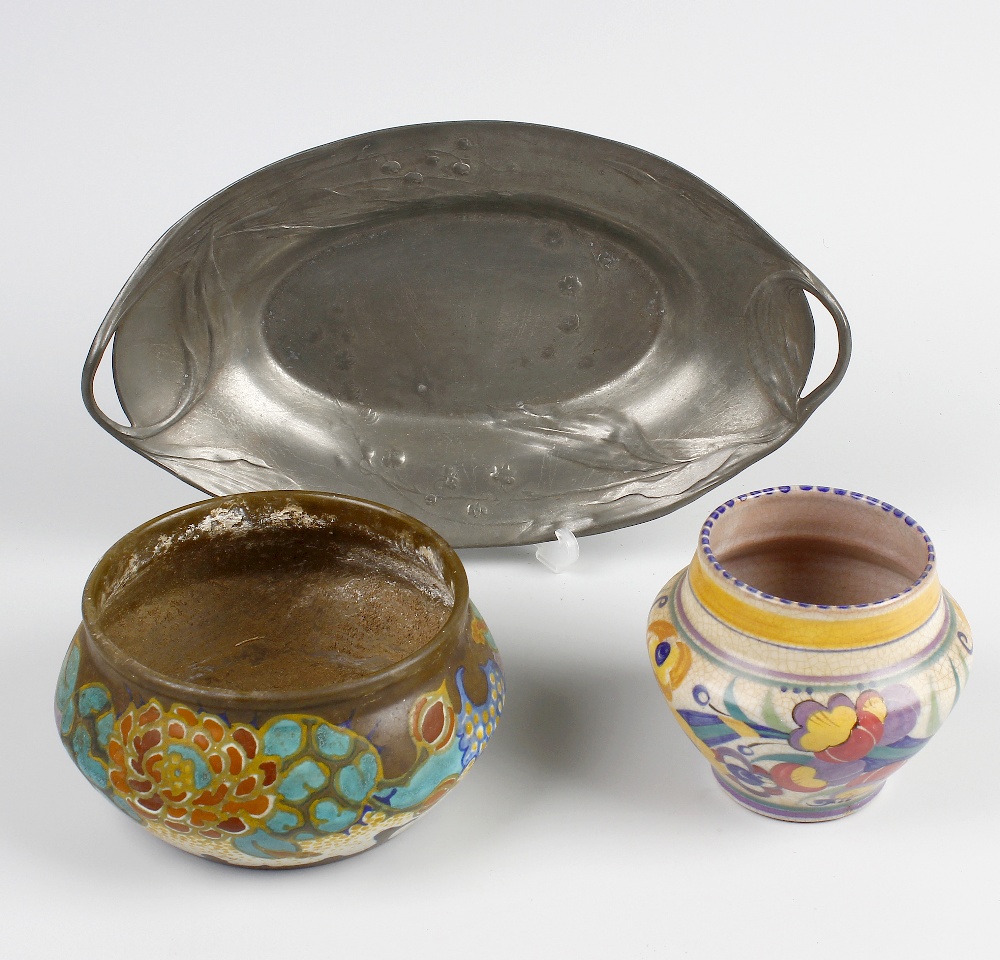 A small Poole pottery bowl, of shouldered form decorated with flowers and with impressed mark